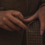 Close Reading: I Annotated a $228 Coat Listing Like a Poem. Two Words Sold Me. woman tying belt brown coat michael stars aster