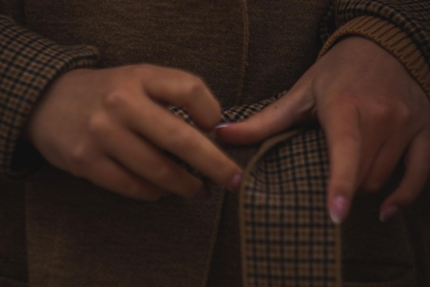 woman tying belt brown coat michael stars aster